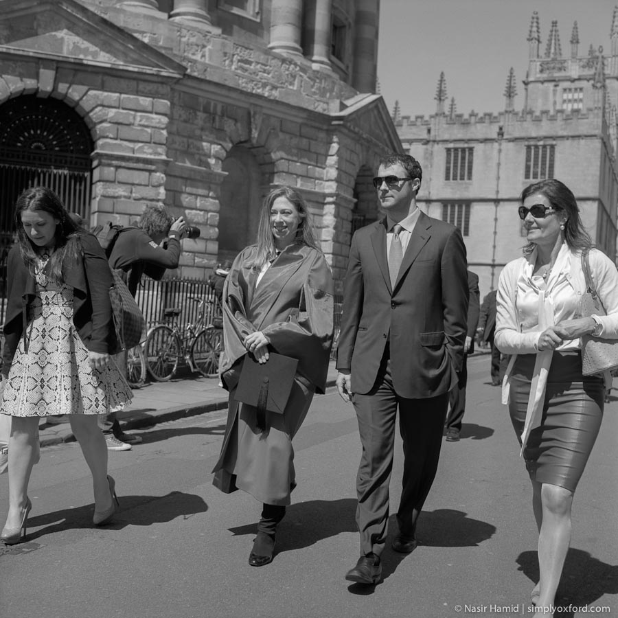 Chelsea Clinton and husband Marc walking in Radcliffe Square, Oxford